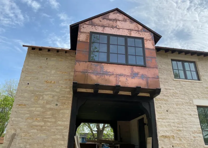 Copper metal panel facade on a stone building for Metal Roof Coating in Seminole